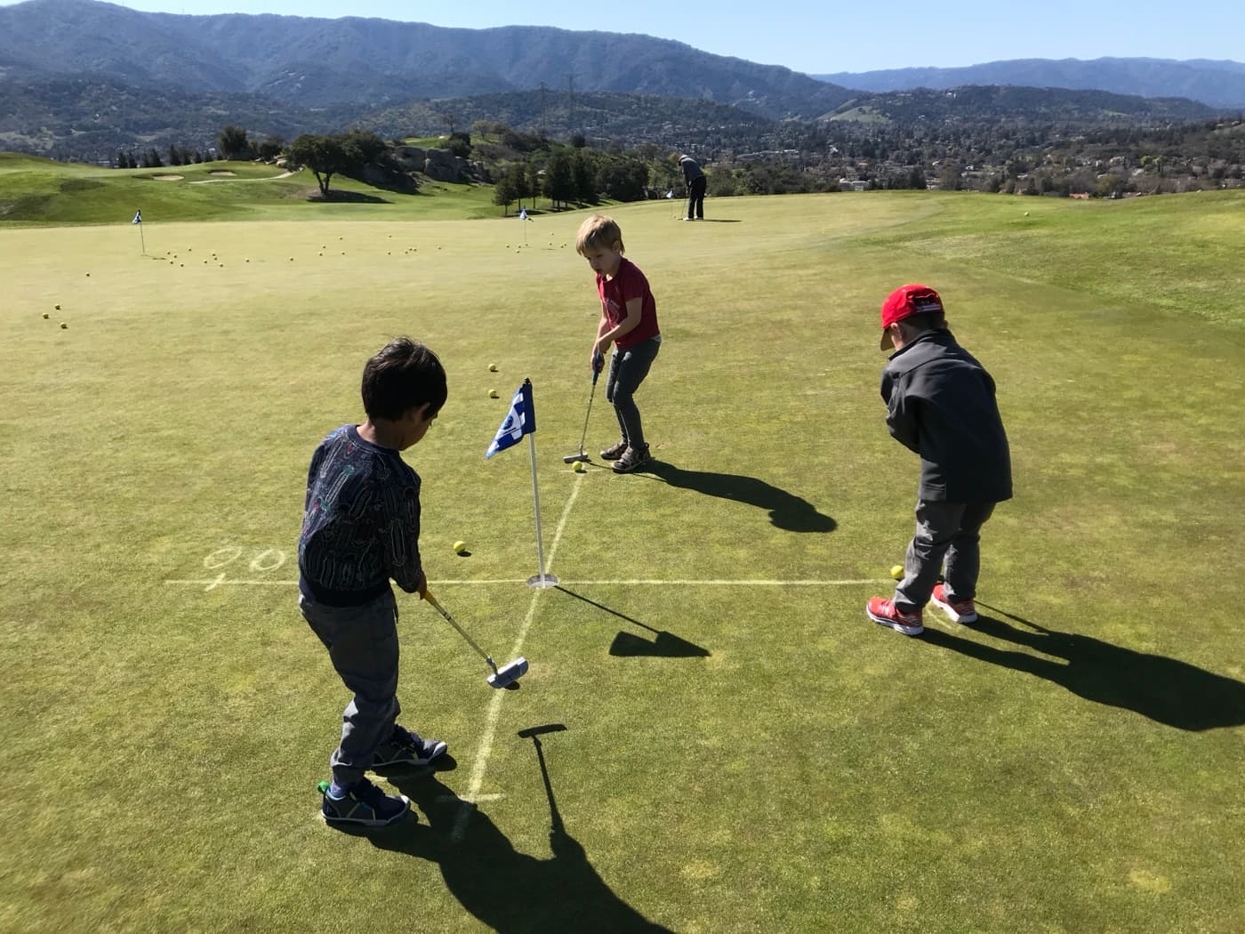 Campers putting on the practice green